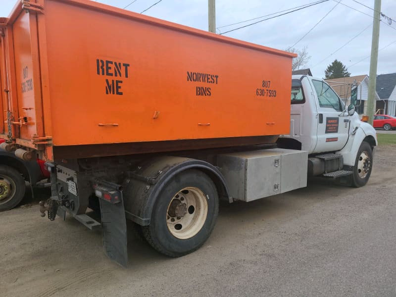 Norwest Bins truck carrying a rental bin in Thunder Bay